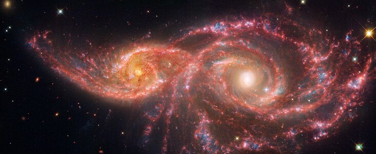 Galaxies IC 2163 and NGC 2207 (Webb and Hubble image)