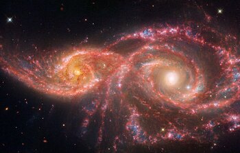 Galaxies IC 2163 and NGC 2207 (Webb and Hubble image)